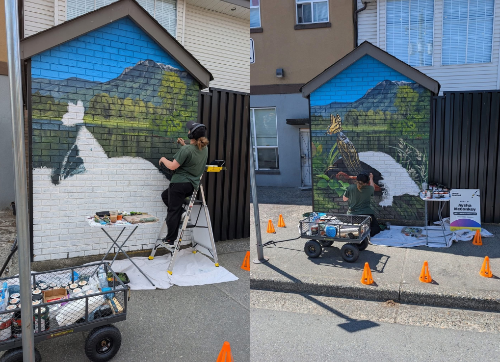 Aysha painting the mural